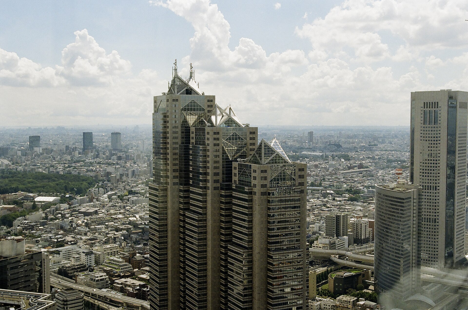Shinjuku Park Tower and its three glass pyramids; Park Hyatt Tokyo occupies floors 39 to 52